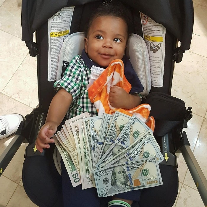 Ace Wells poses with his money