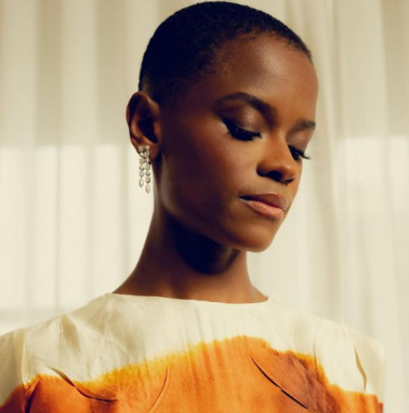 Letitia Wright is posing for her photoshoot. 