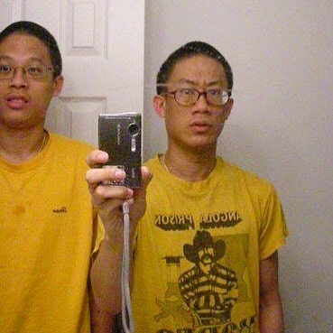 A picture of Stanley Won and his brother Fancis Wong in the same yellow t-shirt.