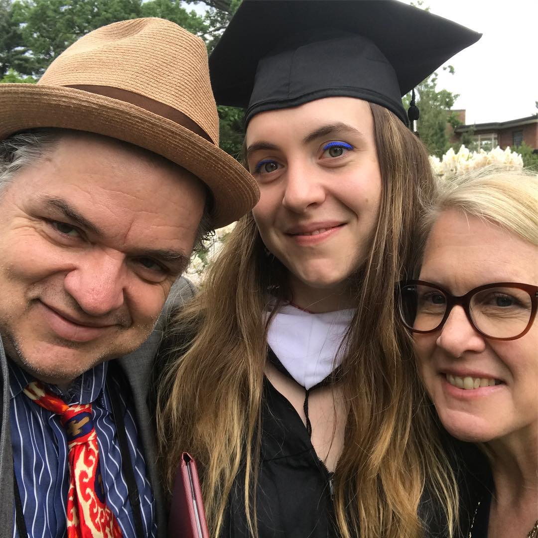 Oliver Platt celebrating his daughter graduation with his wife on right and his daughter on middle