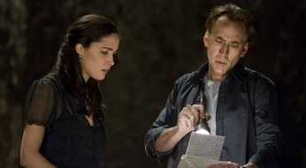 A picture of Tamara Donnellan and Nicholas Cage in one of the scene of the movie Knowing.