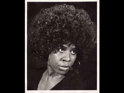 A black and white picture of Dick Anthony Williams wife Gloria Edwards in Afro hair.