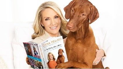 Dana Perino wife of Peter McMahon with her dog Jasper reading the book she wrote.