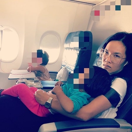 Ali Wong with her two daughter and husband while going on vacation. 