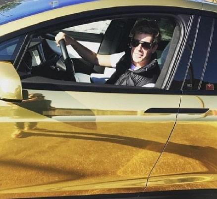 Milo Yiannopoulos golden chrome Tesla which he bought for his husband. 