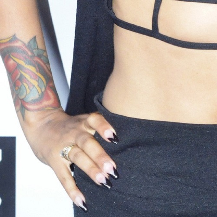 There is a tattoo on Lyrica Anderson's right hand.