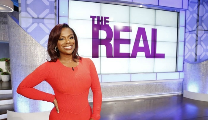 A picture of Kandi Burruss appearing on the show The Real.