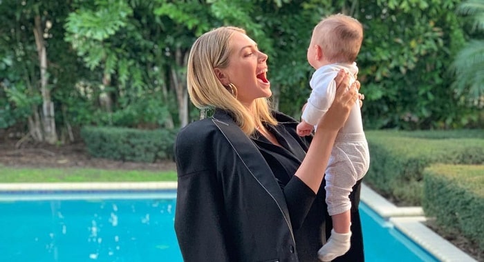 Kate Upton stuns in athletic ensemble as she cradles daughter Genevieve in  a baby carrier