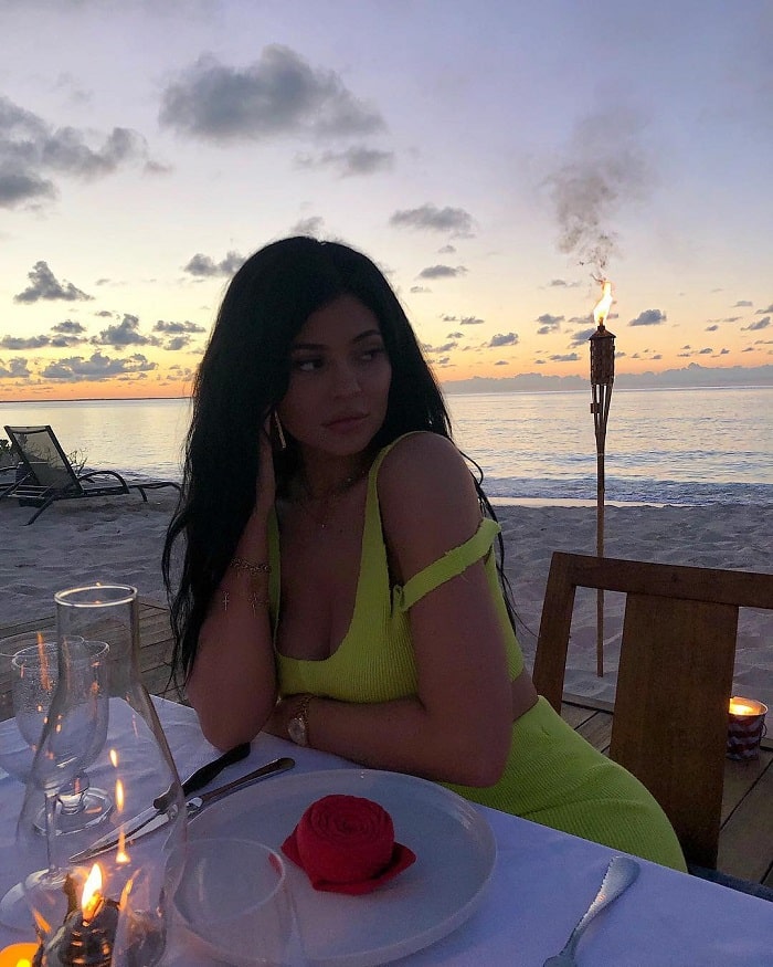 Dinner by the ocean wearing a neon dress