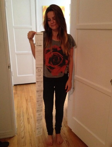 Caryl Hallam taking a photo with CVS receipt.