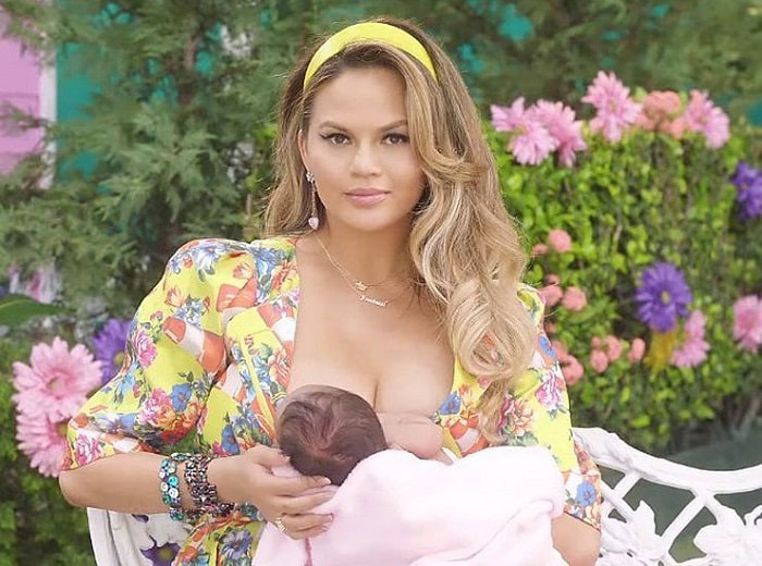 Chrissy Teigen breast feeding her baby