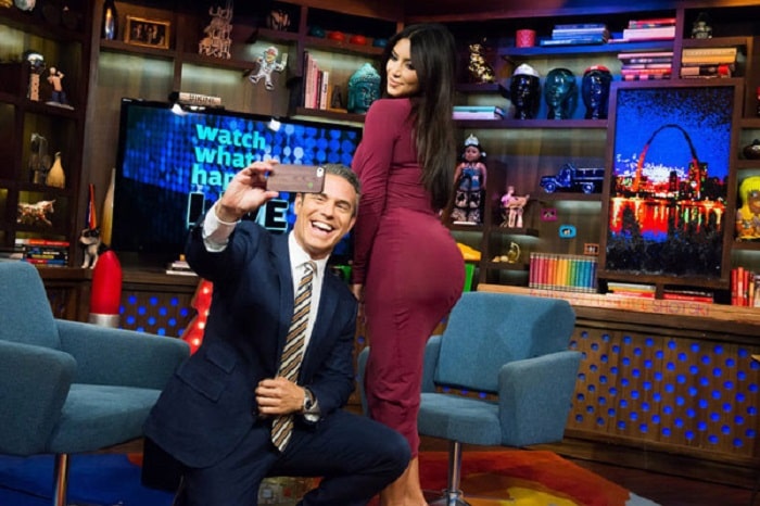 Andy Cohen taking a selfie with Kim's butt