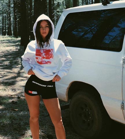 Rachel Cook poses for a picture with her van.