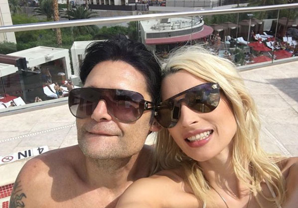 Courtney Anne Mitchell poses for a selfie with her husband Corey Feldman.