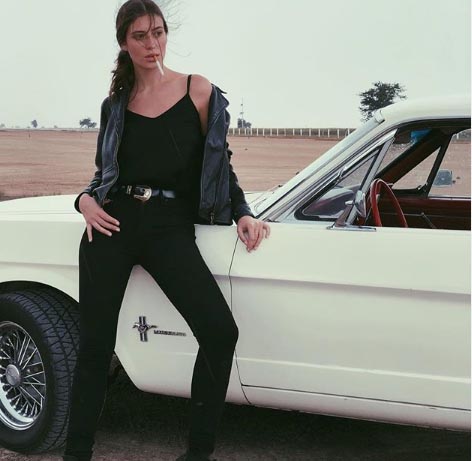 Alejandra Guilmant poses with her white sexy beast car.