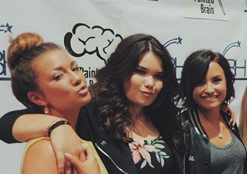 Dallas with her two siblings: Demi Lovato and Madison De La Garza.