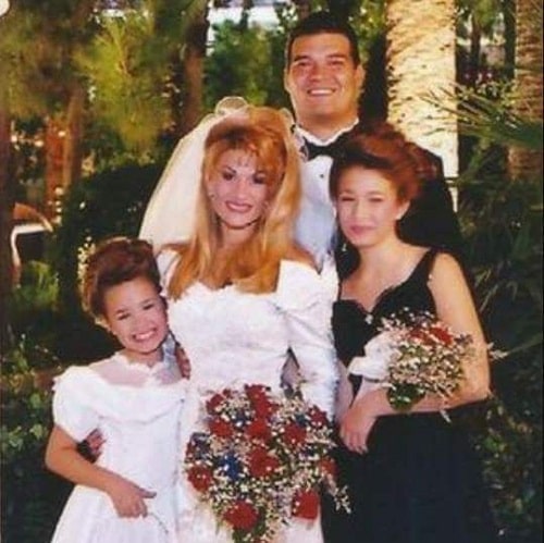Eddie with his wife and two step daughters on his wedding day.