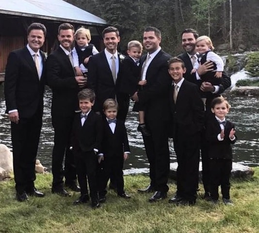 Christopher and his siblings on his wedding day.