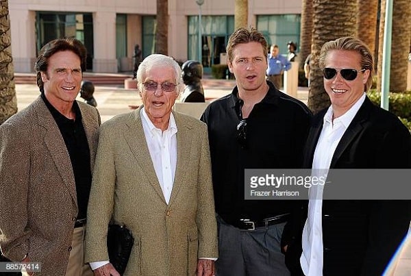 Alex's adoptive father Carey with his family.