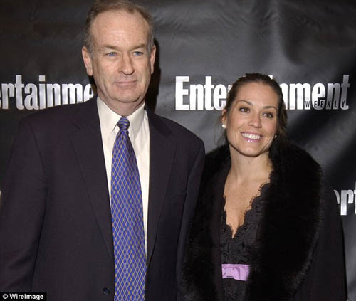 Maureen E. McPhilmy and Bill O'Reilly taking a picture together.
