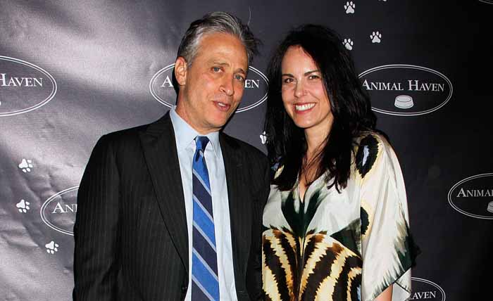 Tracey McShane and Jon Stewart pose for a picture.