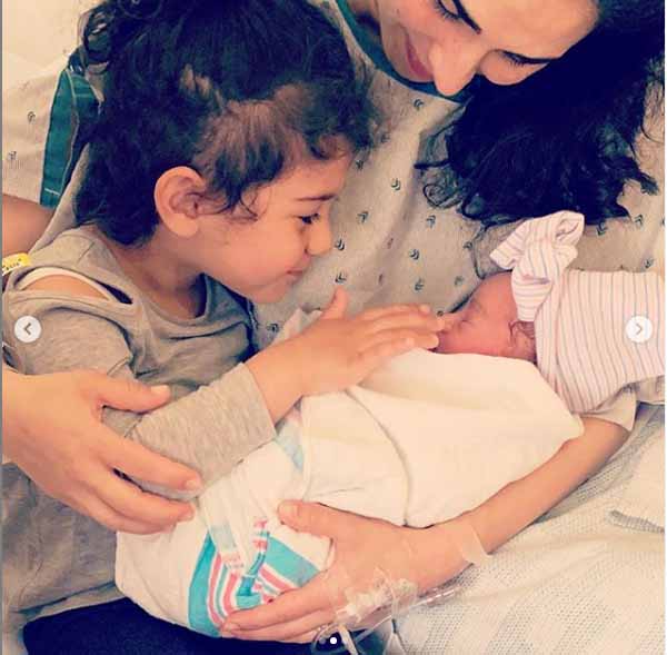 Araksya Karapetyan taking picture with her children.