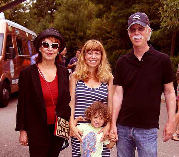 Steve Janowiz and Joy Behar taking family photo.