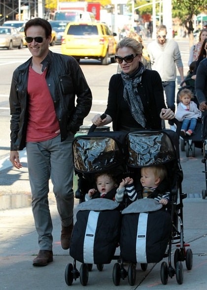 Charlie and his sibling, Poppy with their parents on a stroll.