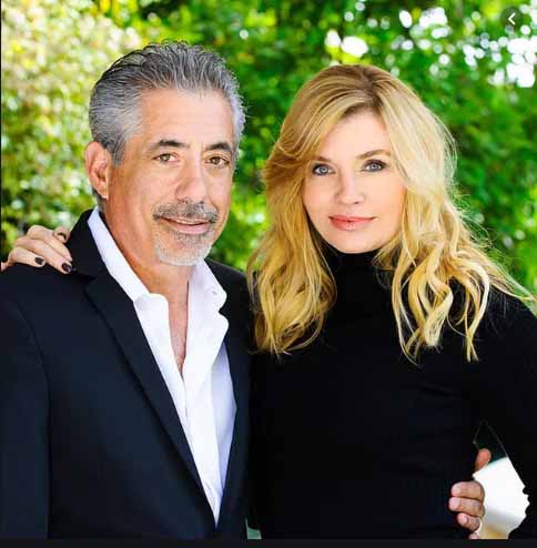 Nadine Caridi and her husband John poses for a picture.