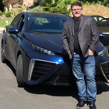 A picture of Sean Astin with his Toyota FCV car.