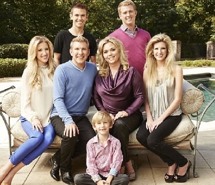 A picture of Julie Chrisley with her husband and childrens.