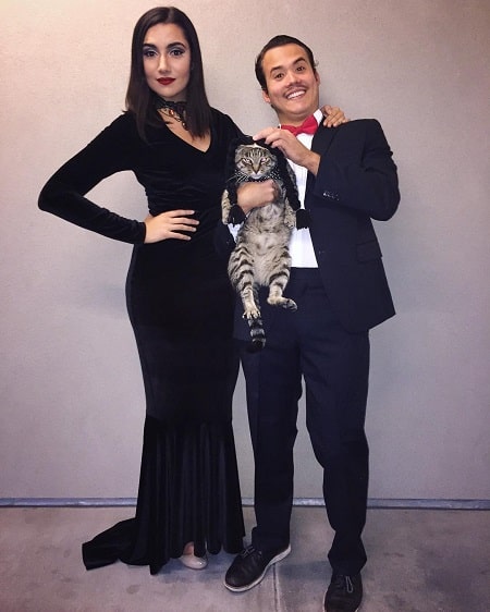 Tyler William with Safia Nygaard and their cat Crusty.