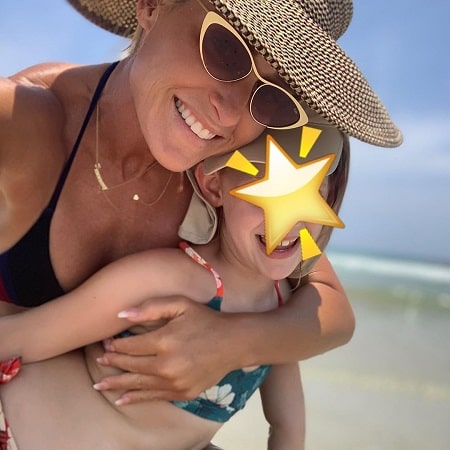 Michelle McCool posted a picture of her daughter Kaia Faith Calaway while putting a star sticker in her face.