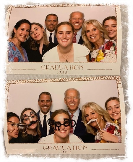 A picture of Finnegan Biden youngest sister Maisy Biden (front on white dres) on her graduation day.