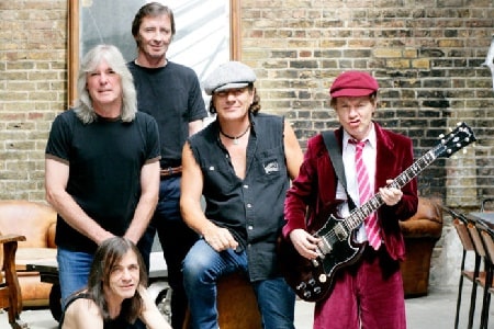 Brian Johnson with the band member of AC/DC. 