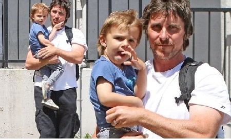 Christian Bale carrying his son Joseph Bale.
