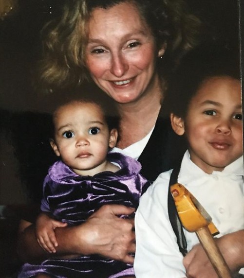 Deborah Elizabeth Sawyer holding her children Doja Cat and Older son