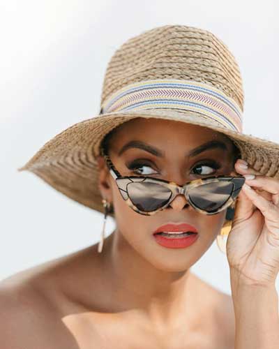 Tika Sumpter with her shades and hat