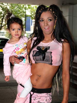 Chloe Khan carrying her daughter Destiny