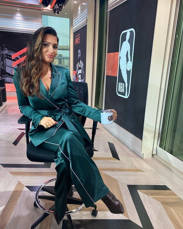 Molly Qerim wearing a peacock blue colored suit.
