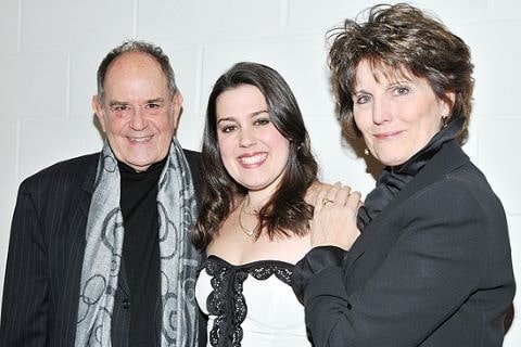 Katharine Luckinbill with her grandparents in the confress meeting of Desilu,too LLC