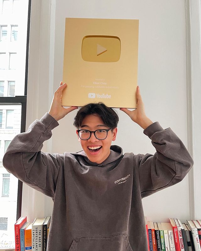 Elliot Choy celebrating his golden button from YouTube