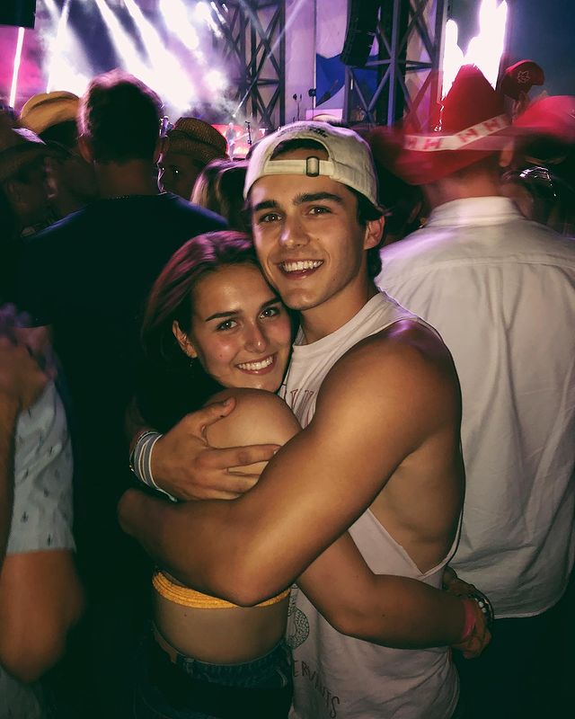 Charlie Gillespie with his younger sister Meghan Gillespie on a party wearing a white hat and tank top 