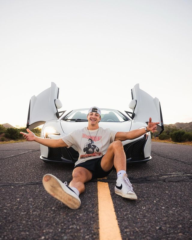  Brueckner wearing a white tee and black shorts.