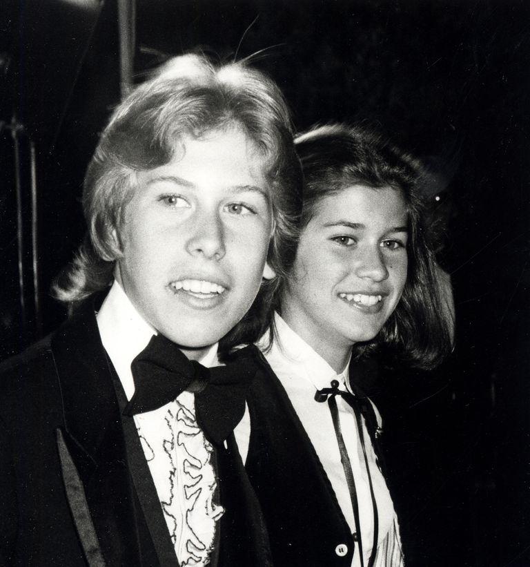 Philip McKeown with his sister Nancy McKeown attending an award function wearing a suit pant 