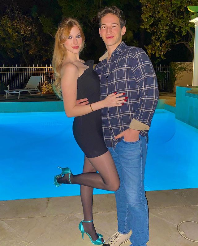 Jackie R. Jacobson with her boyfriend Ben Elkayam  wearing a black bodycon dress