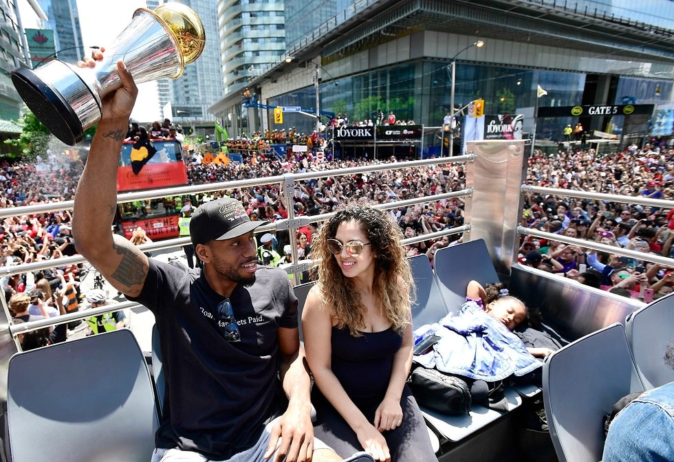 Kaliyah Leonard  wearing a purple skirt sleeping in the backside while her parents are celebrating their winning in Toronto Raptors