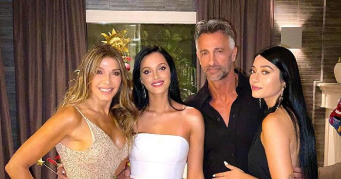 Oriana Sabatini with her family on a family gathering party wearing a long black gown 