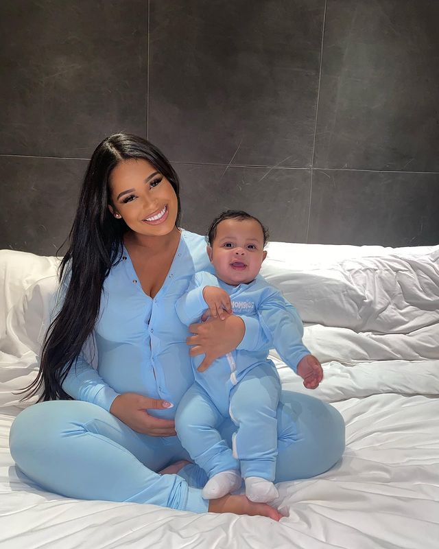 Taina Williams with her baby boy Essex Williams wearing a baby blue swimsuit