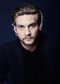 Picture of Jake Weary looking at the camera and posing for a photo in full black themed concept 